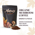 Morm's Organic Mushroom Coffee package with coffee grounds on a white background